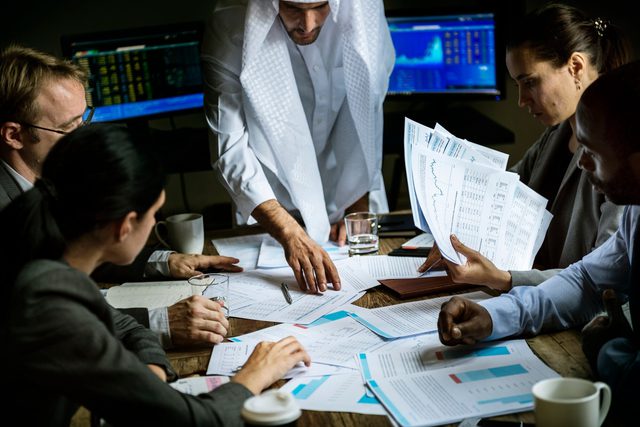 Auditors reviewing financial documents with a client